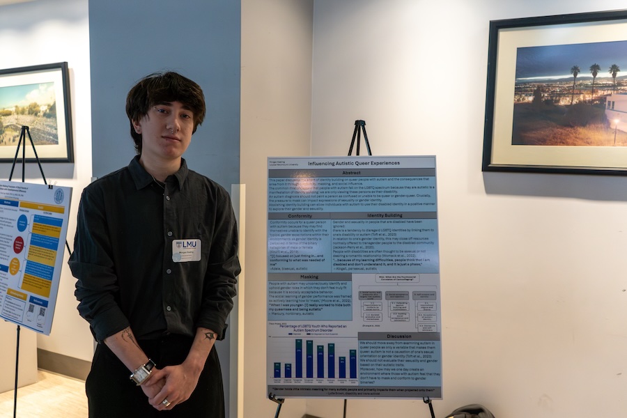 A student presenting research poster